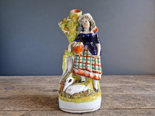 Antique Staffordshire flatback statue of a girl with a swan.