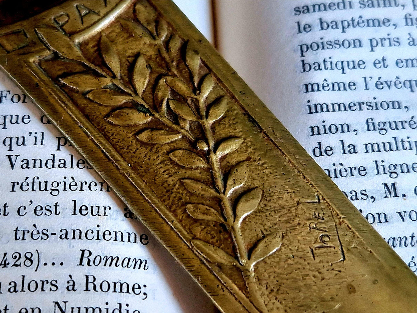 French bronze Art Nouveau paper knife with ladies head decoration.