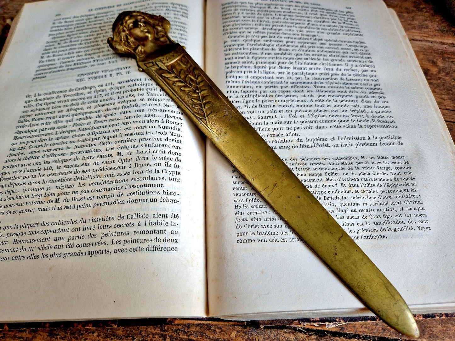 French bronze Art Nouveau paper knife with ladies head decoration.