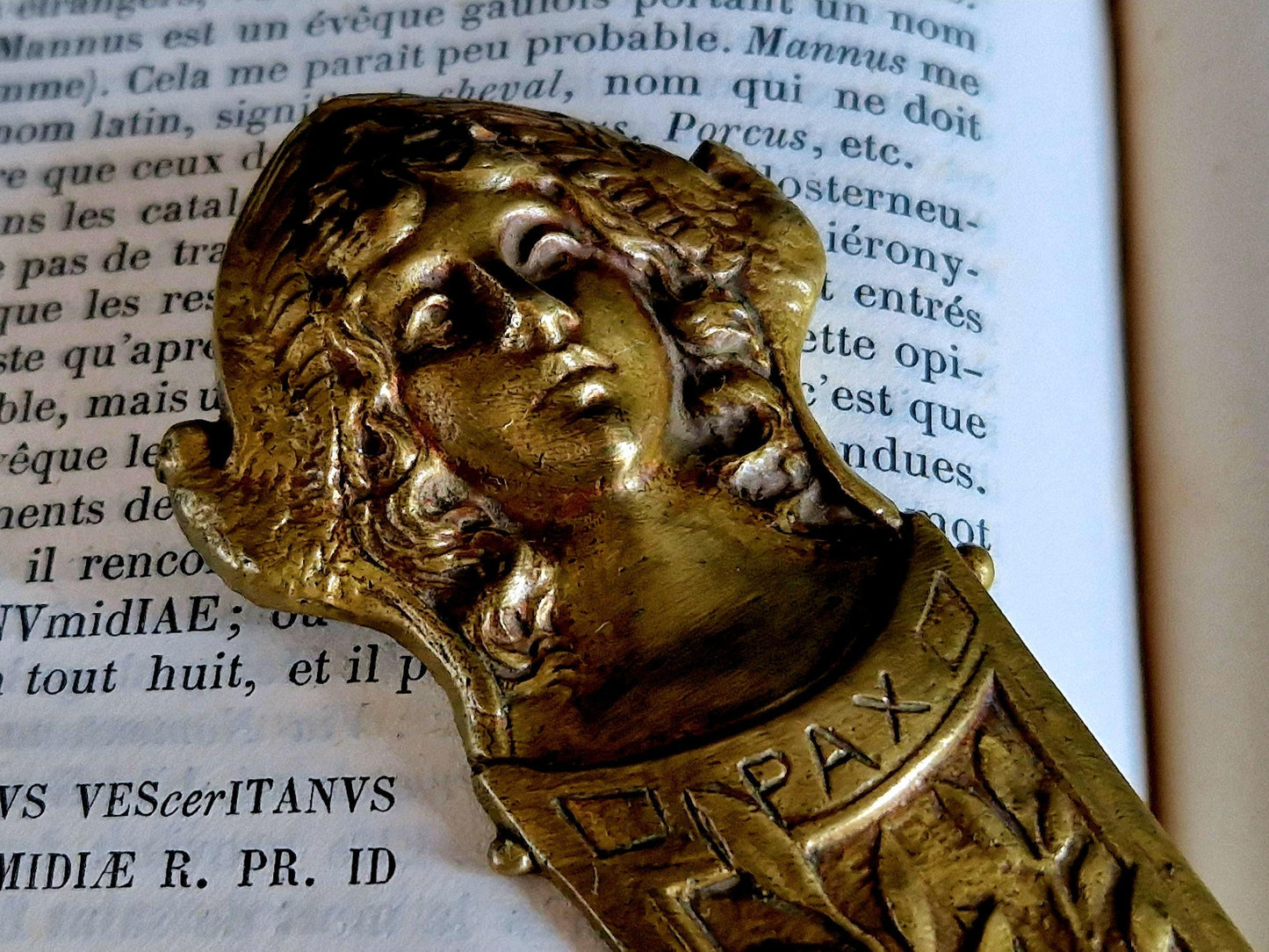 French bronze Art Nouveau paper knife with ladies head decoration.