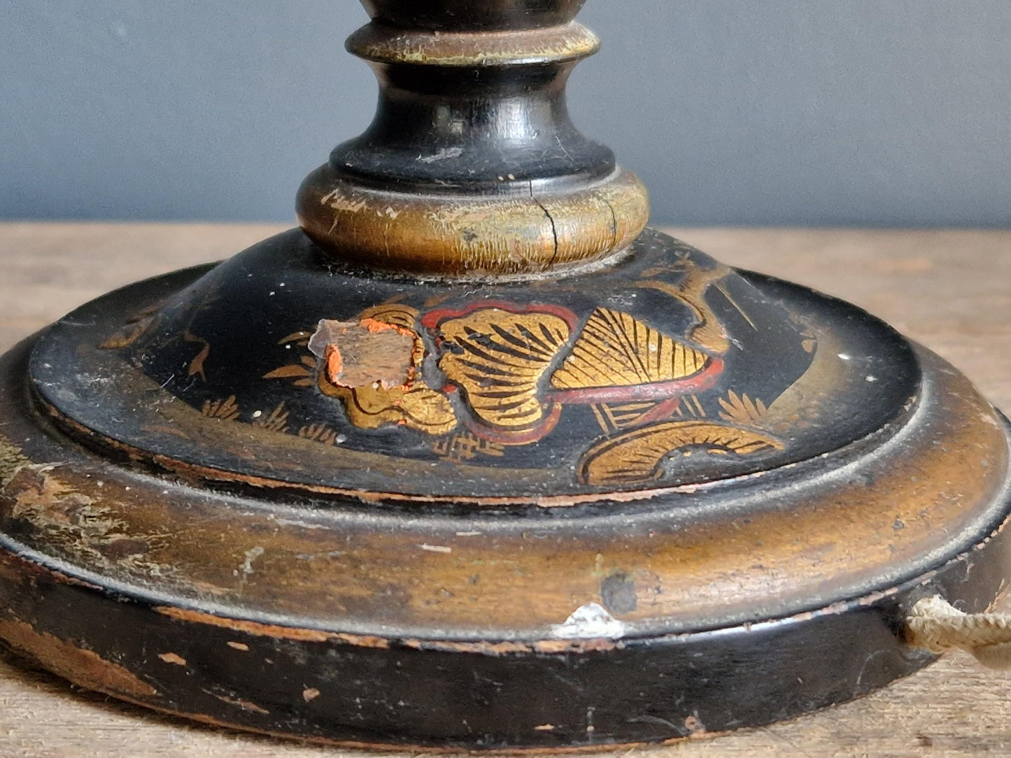 Antique Chinoiserie black table lamp with gilt highlight decoration.