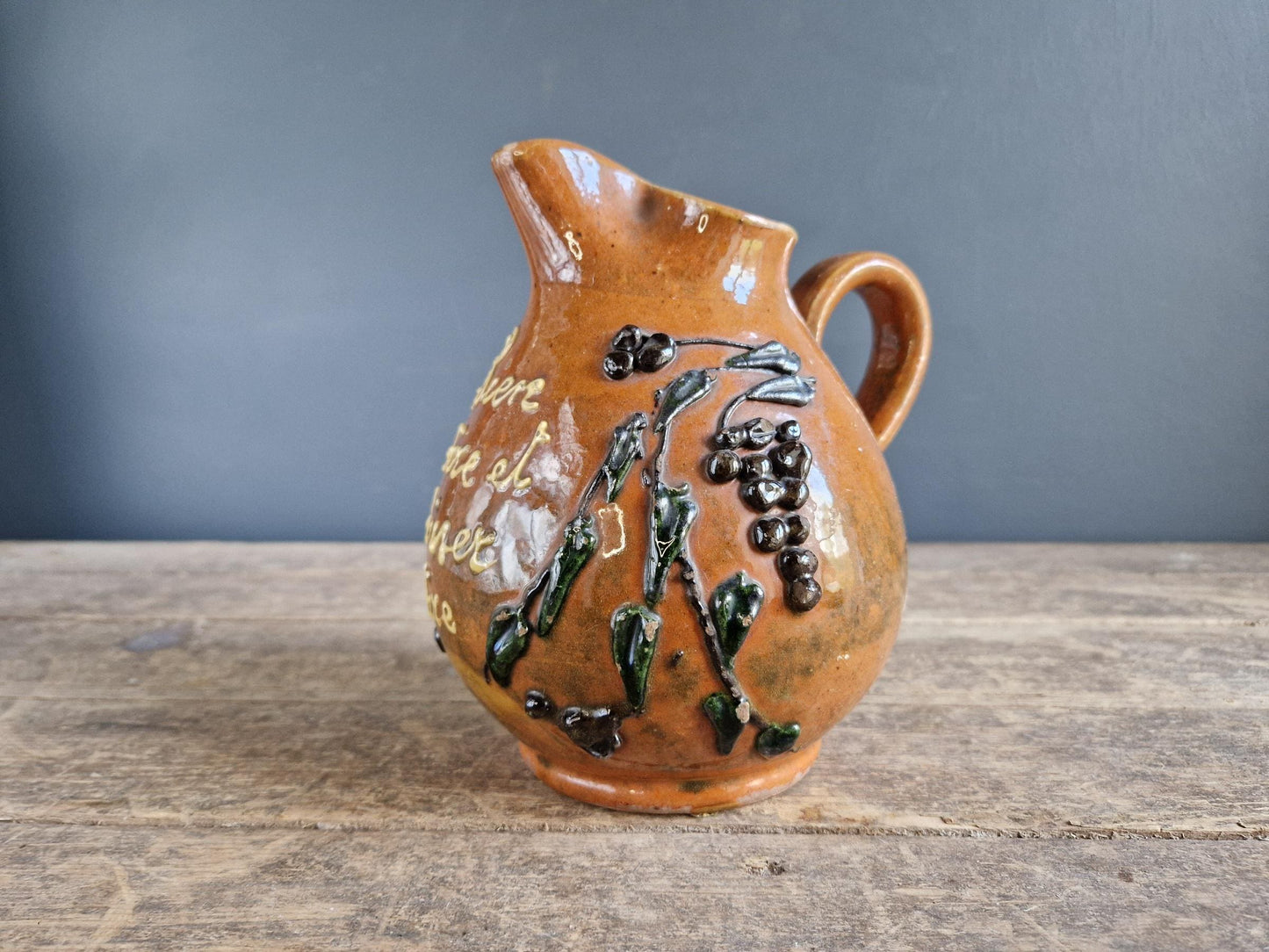 French country beer jug. Country pitcher. Old French jug with beer saying decoration.