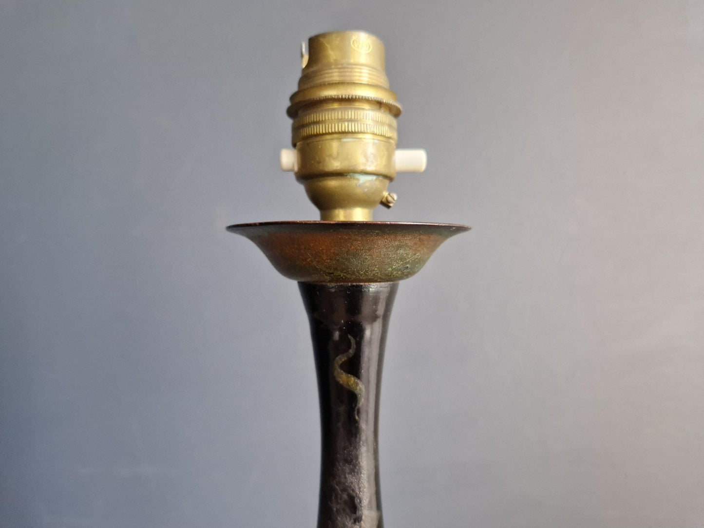 Antique Chinoiserie black table lamp with gilt highlight decoration.