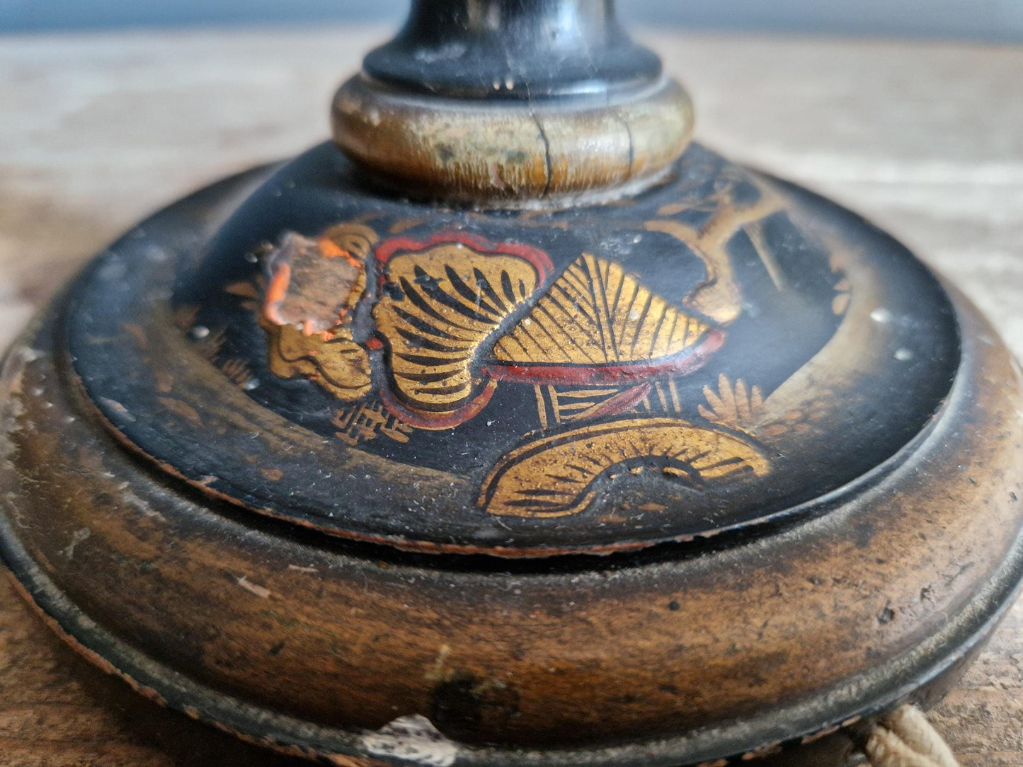 Antique Chinoiserie black table lamp with gilt highlight decoration.