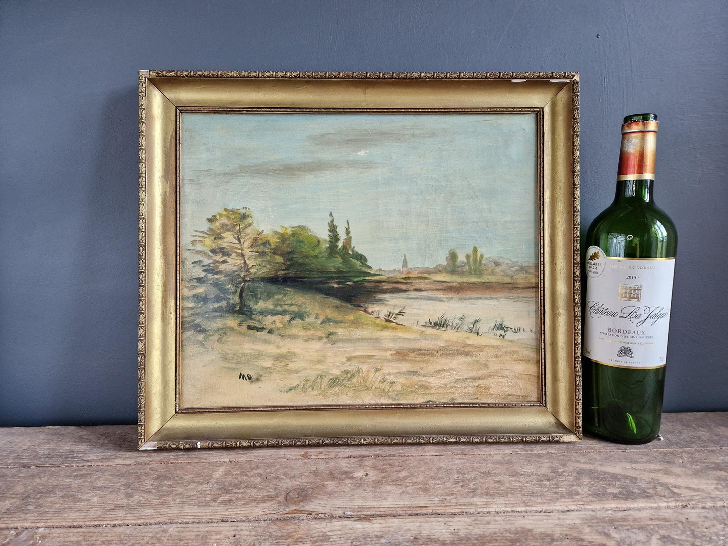 Antique oil painting of a lakeside scene. French oil painting.