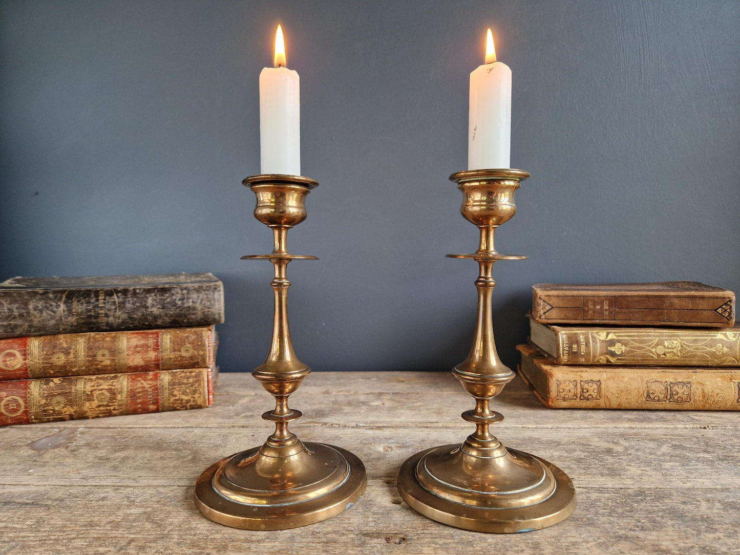 French antique candlesticks. Antique brass candle holders with wax drip plate beneath.