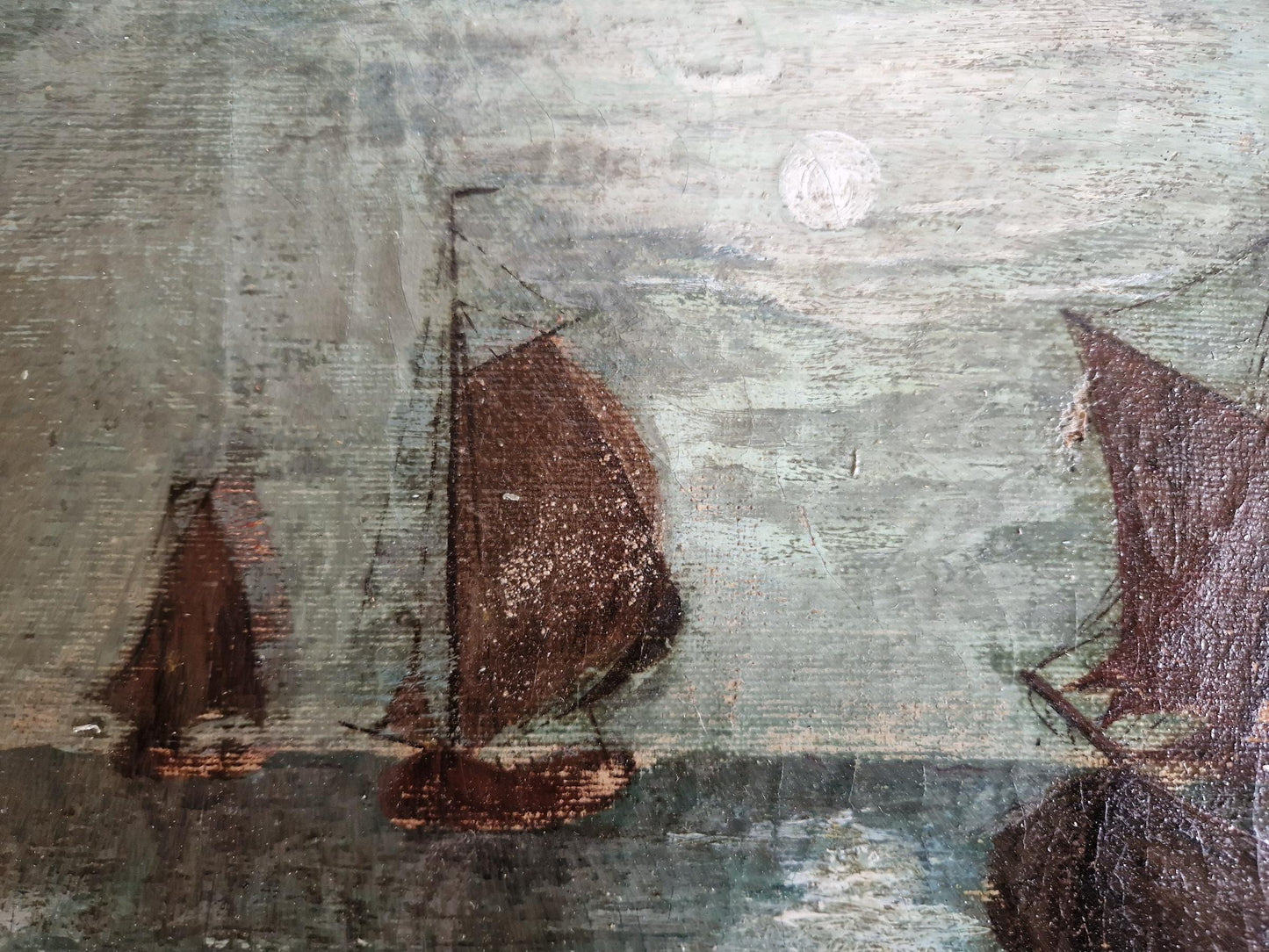 French antique seascape oil painting showing fishing boats on the sea in the moonlight.