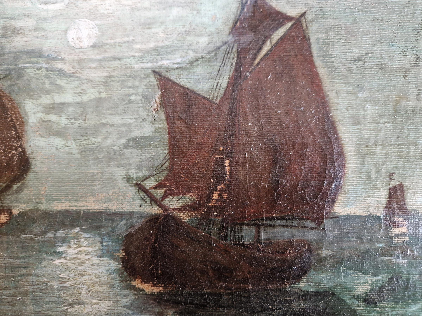 French antique seascape oil painting showing fishing boats on the sea in the moonlight.