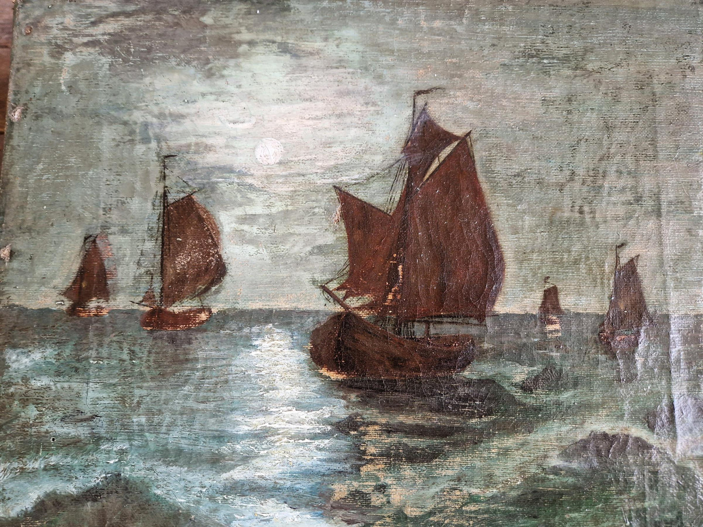 French antique seascape oil painting showing fishing boats on the sea in the moonlight.