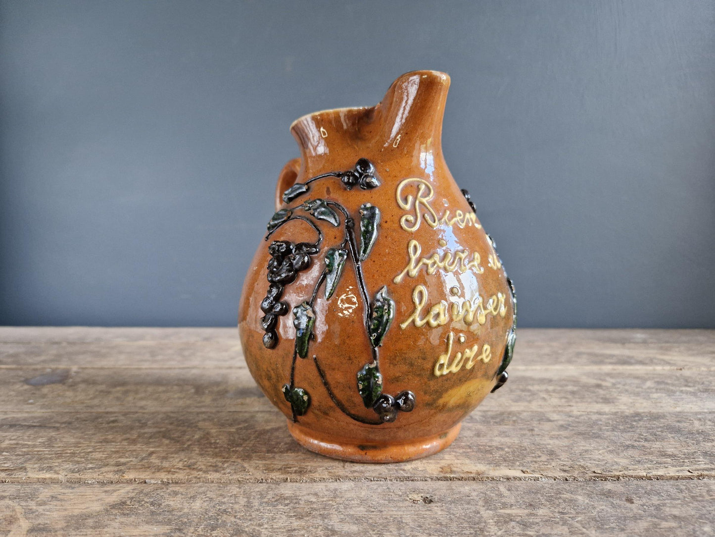 French country beer jug. Country pitcher. Old French jug with beer saying decoration.