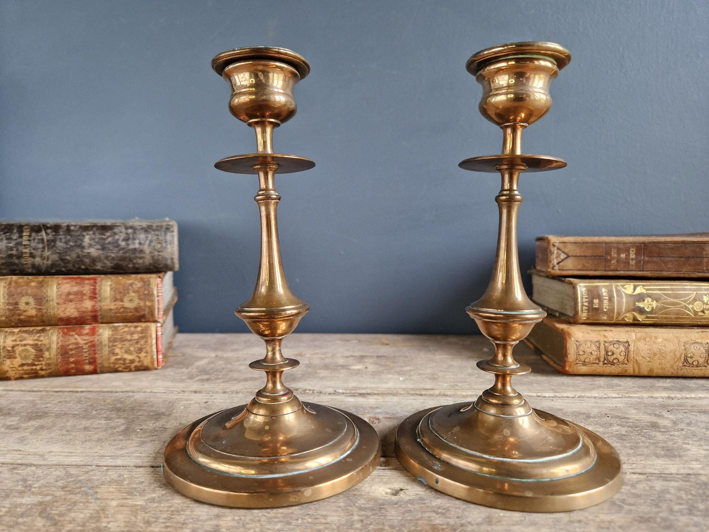 French antique candlesticks. Antique brass candle holders with wax drip plate beneath.