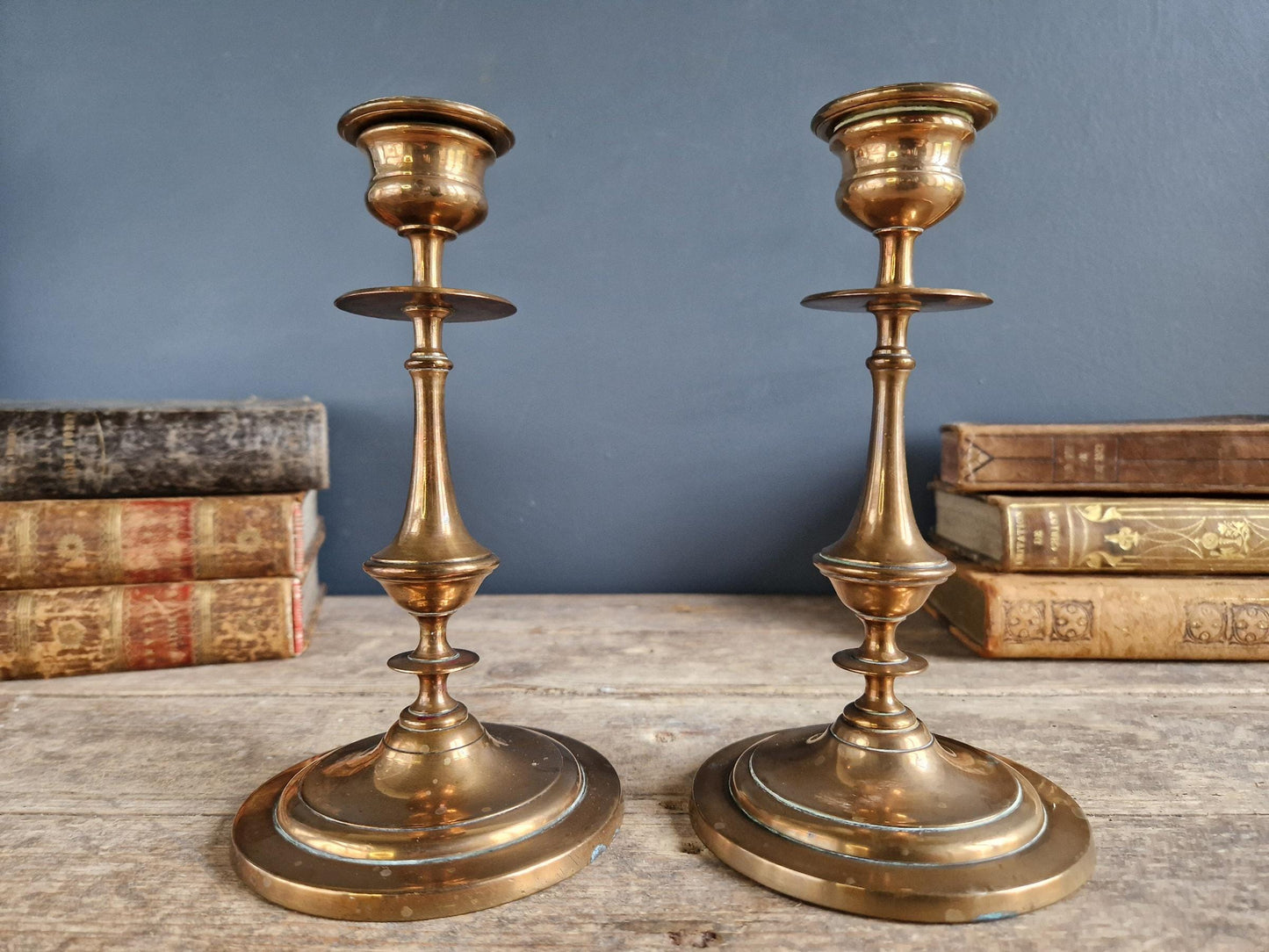 French antique candlesticks. Antique brass candle holders with wax drip plate beneath.