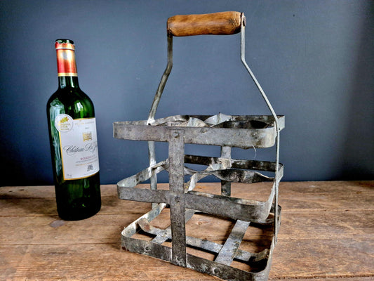 French vintage metal bottle carrier with wooden handle.