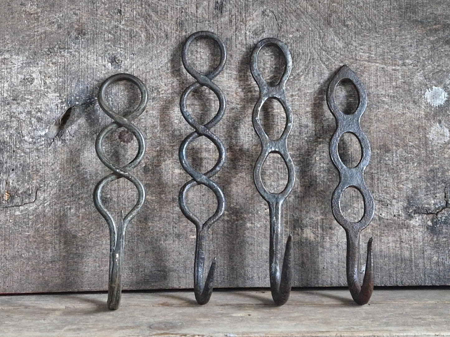 Four old French charcuterie hooks. Antique meat hooks for kitchen decor.